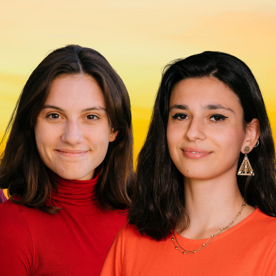 Three women smiling with a colourful background