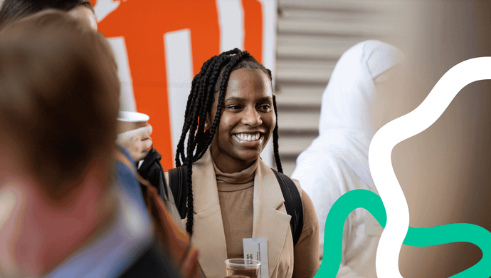 A smiling young woman at an event