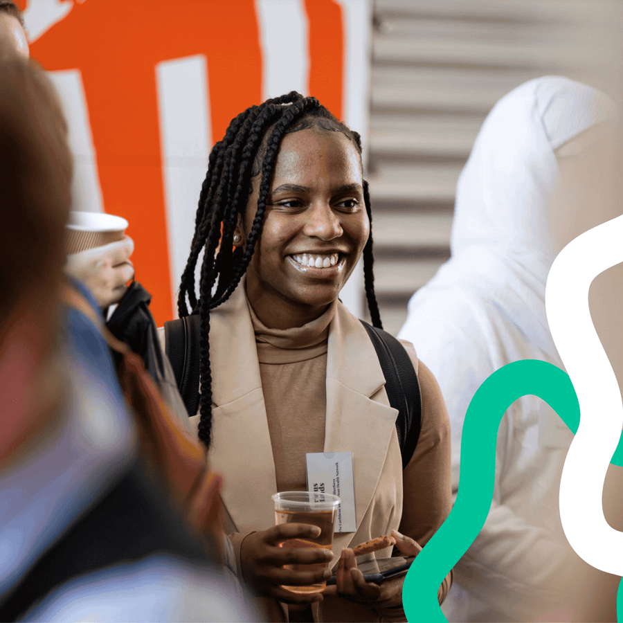 A smiling young woman at an event